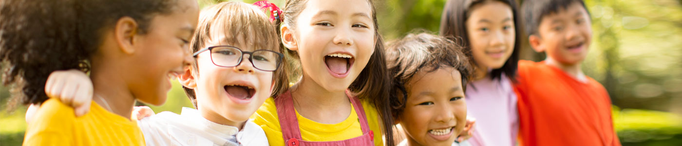 6 young kids playing outside and having fun